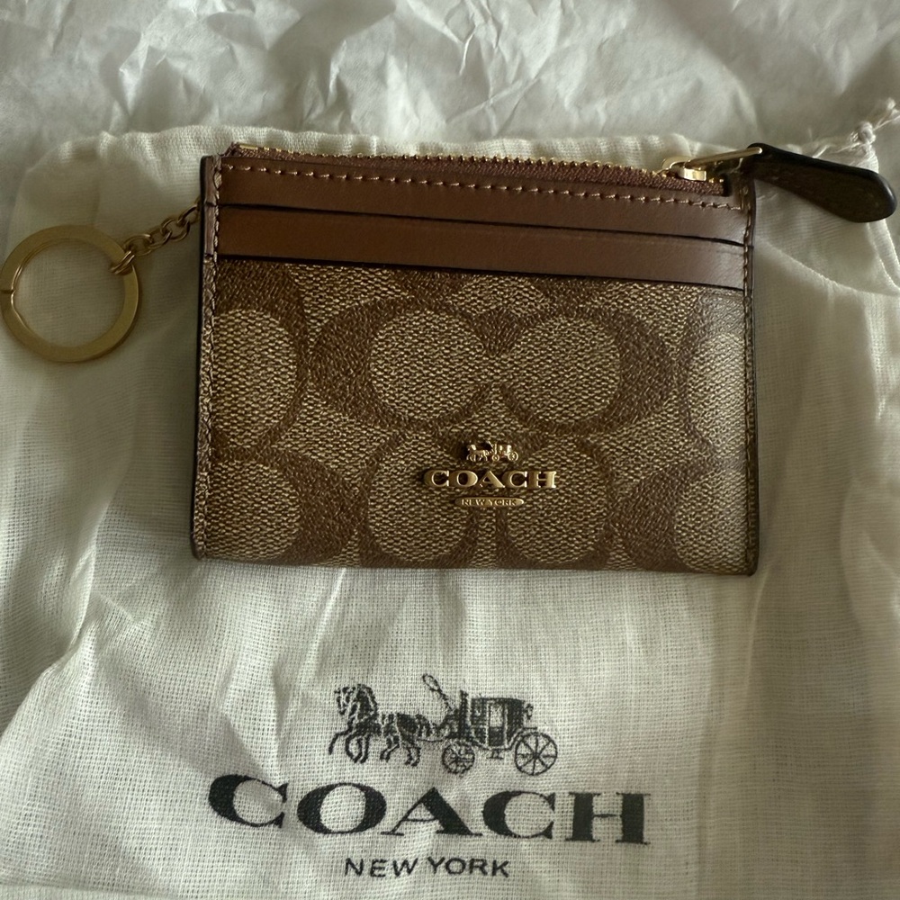 New with tags Coach Signature Brown and tan and gold Key Card Holder